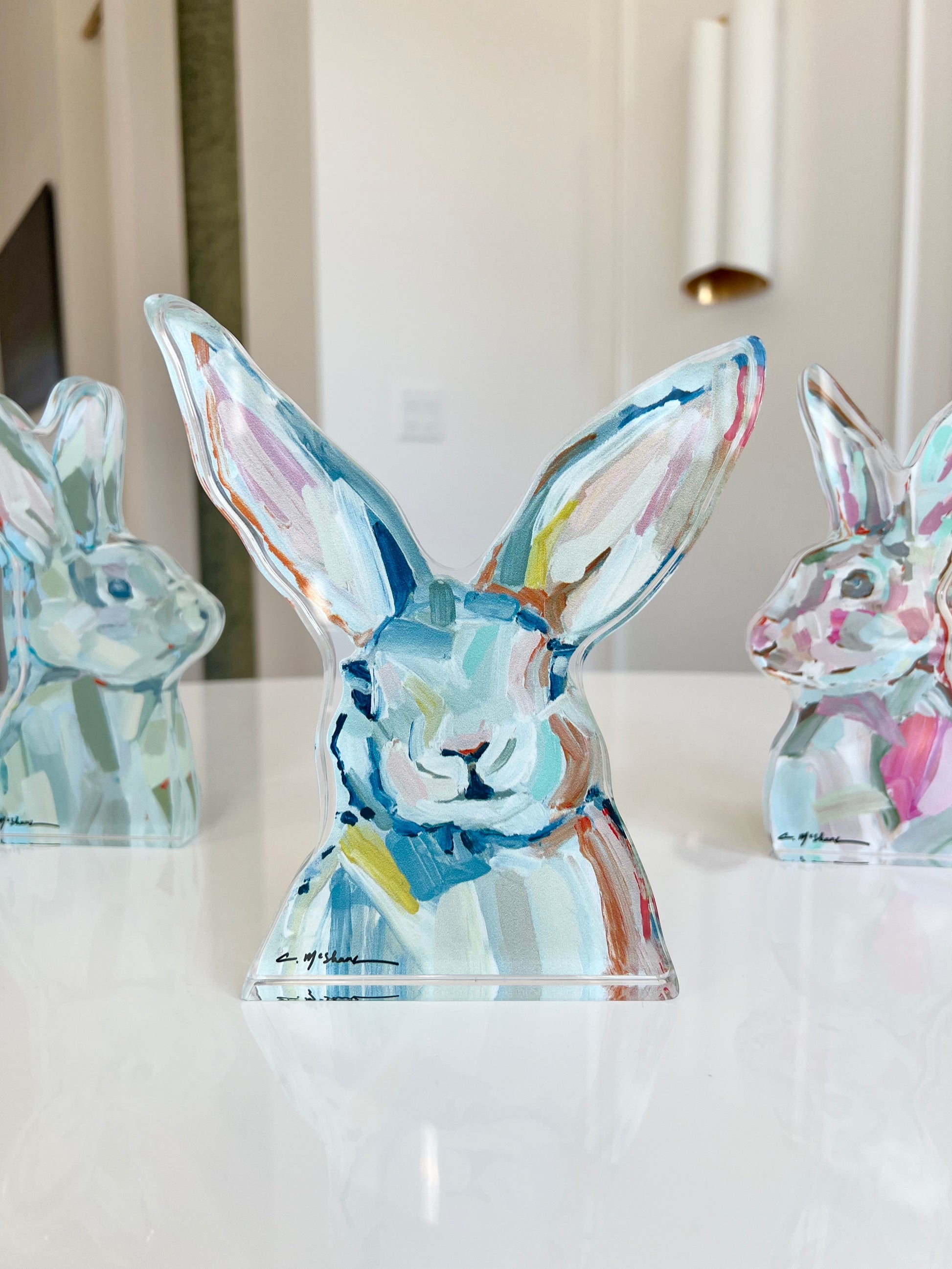 An acrylic tabletop bunny that is great for Easter decor or a nursery gift.