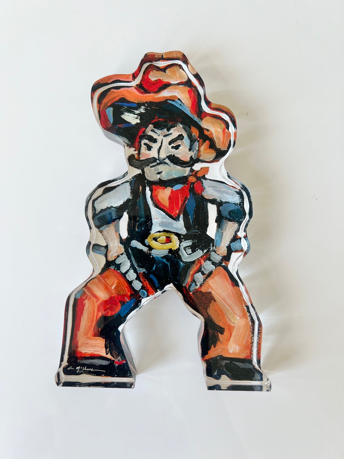 An acrylic tabletop shelfie of a Cowboy from OSU or Oklahoma State University.