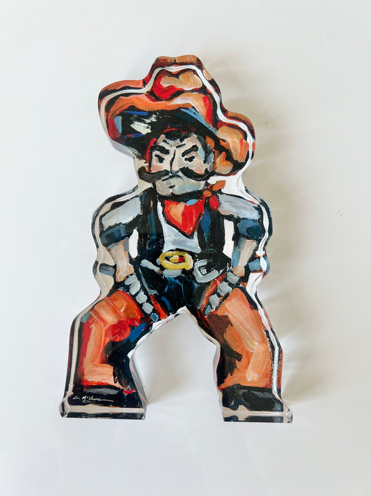 An acrylic tabletop shelfie of a Cowboy from OSU or Oklahoma State University.