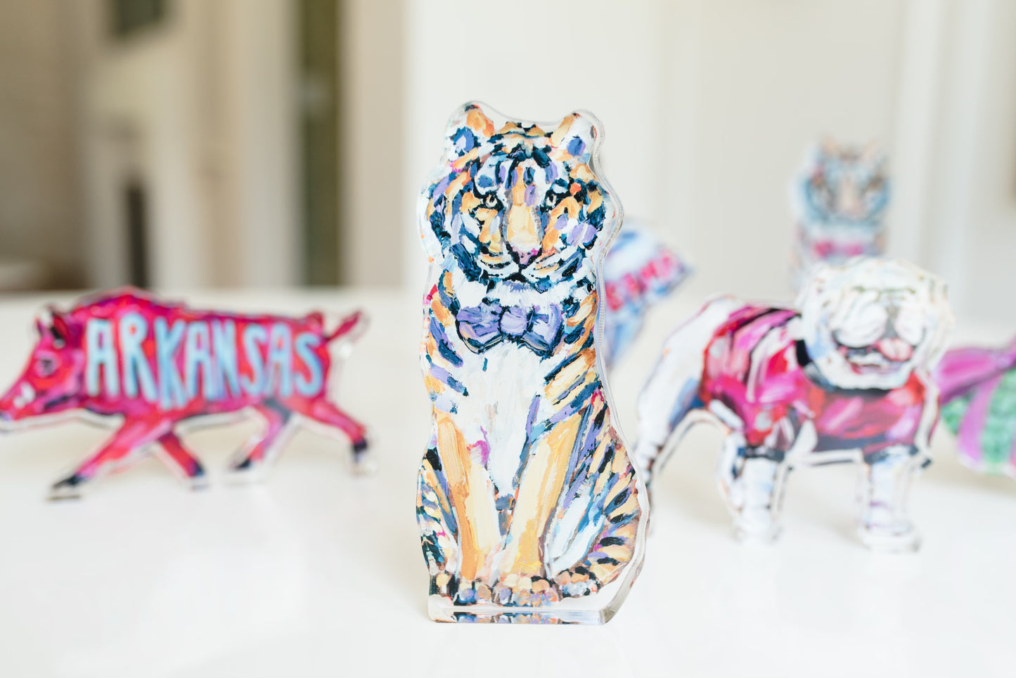An acrylic tabletop of a yellow and purple tiger mascot for the University of Louisiana LSU college gameday or alumni gifts.