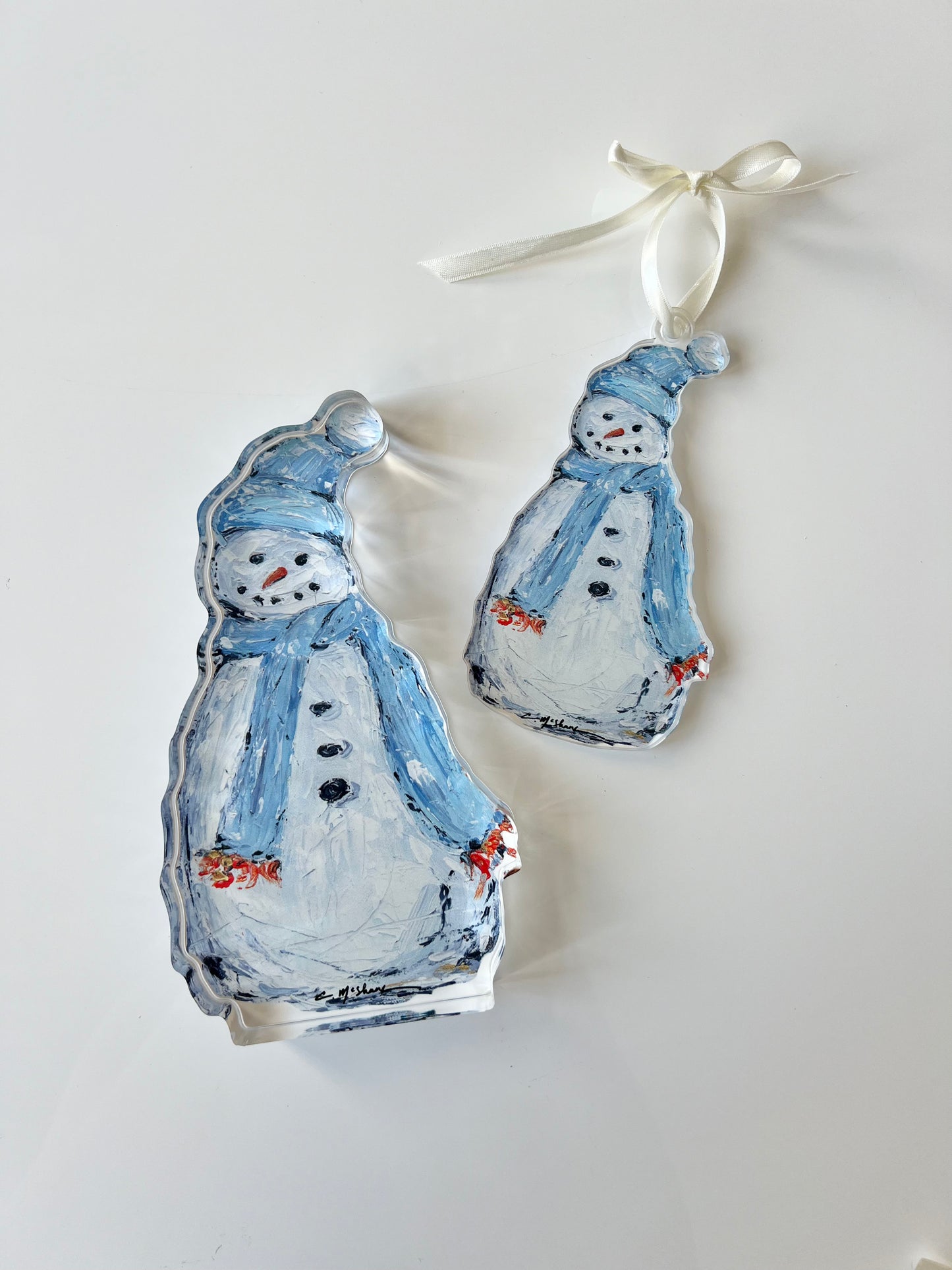 An acrylic snowman with a scarf