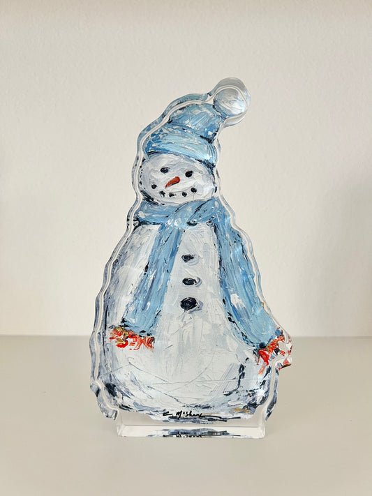 An acrylic snowman with a scarf
