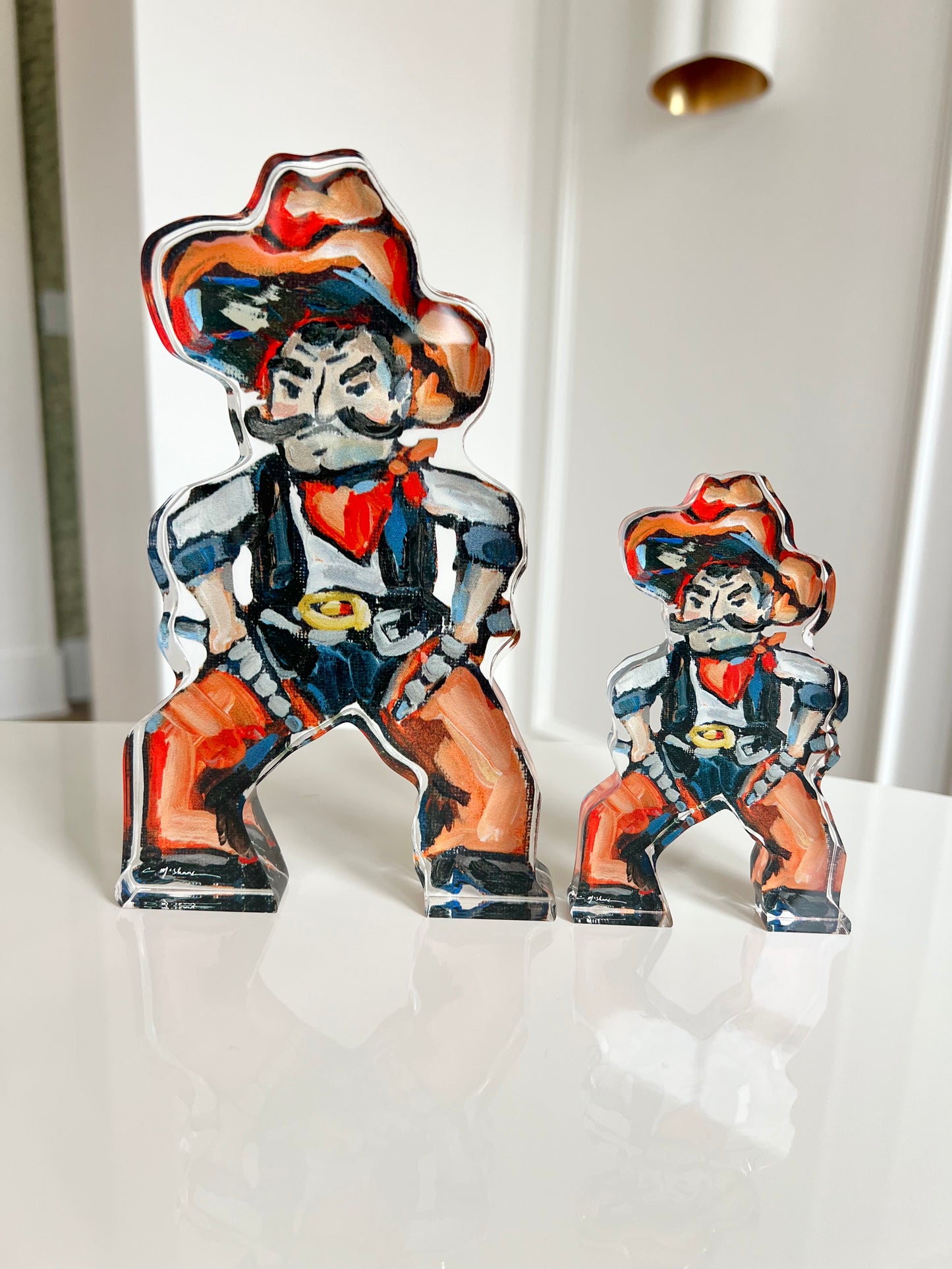 An acrylic tabletop shelfie of a Cowboy from OSU or Oklahoma State University.