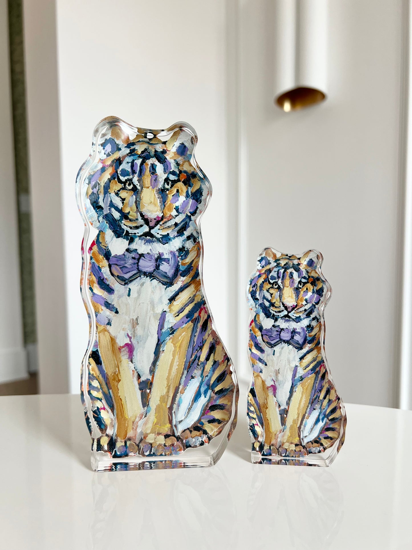 An acrylic tabletop of a yellow and purple tiger mascot for the University of Louisiana LSU college gameday or alumni gifts.