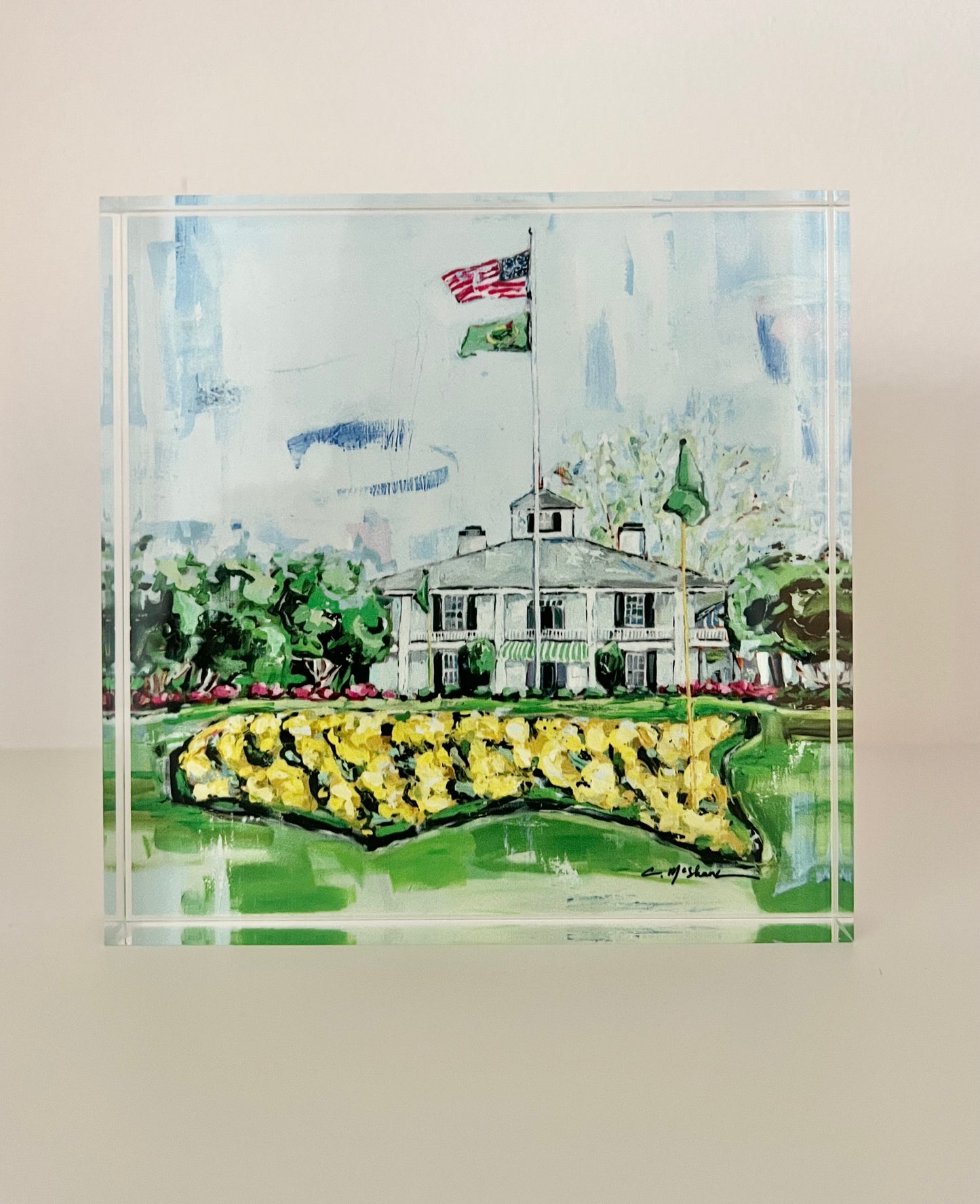 A painting of the Master's Augusta Golf Clubhouse that is on an acrylic tabletop block and makes great man gifts or husband gifts.