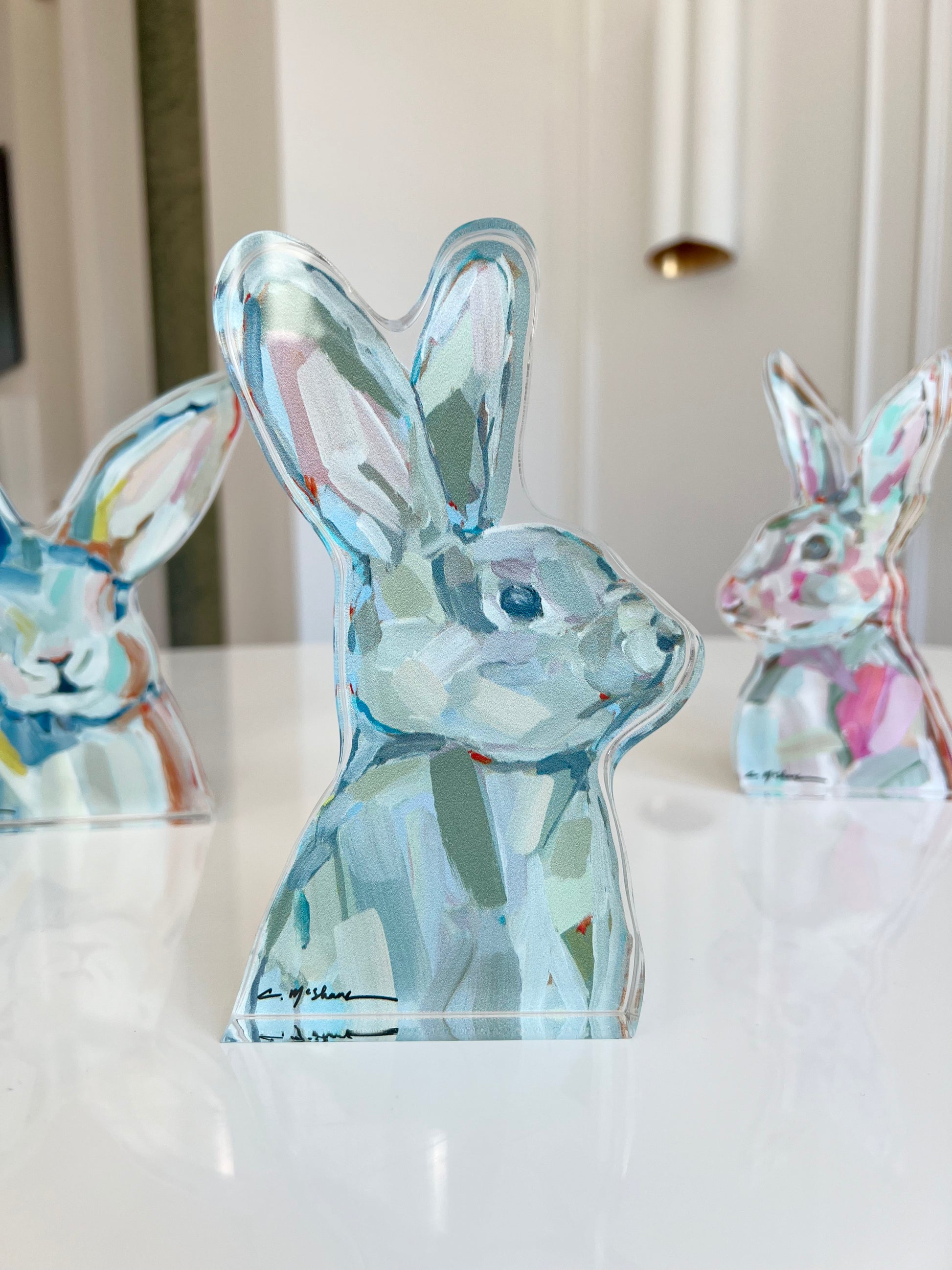An acrylic tabletop bunny that is great for Easter decor or a nursery gift.