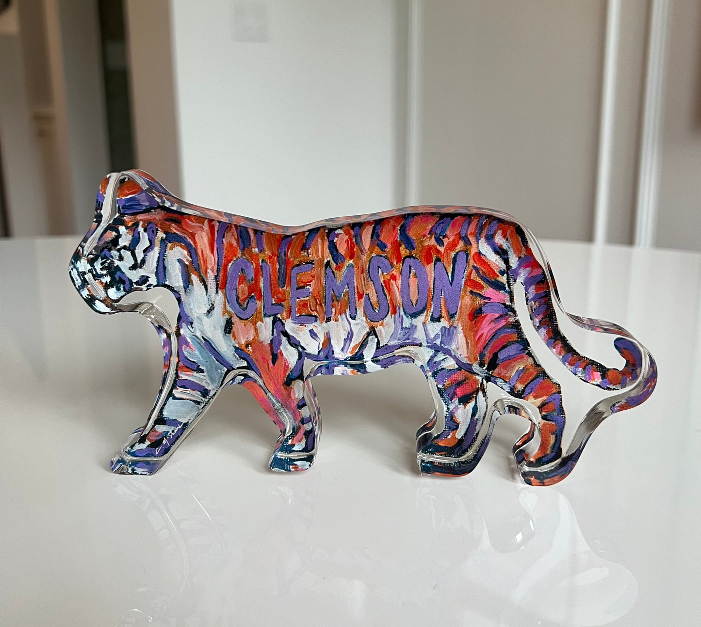 An acrylic tabletop of a purple and orange tiger for Clemson University for college gameday or alumni gifts.