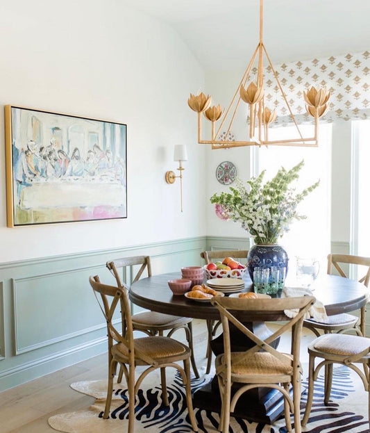 A dining room of the Last Supper canvas print depicting Jesus and his disciples g around a table, interpreted in an abstract style with soft, blended brush strokes. The artwork is Chelsea McShane.