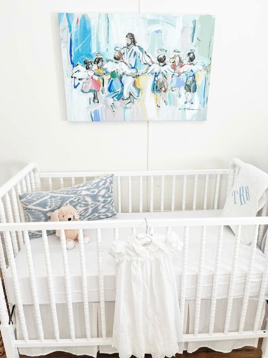 Dancing with Jesus canvas print in a nursery above a crib. 