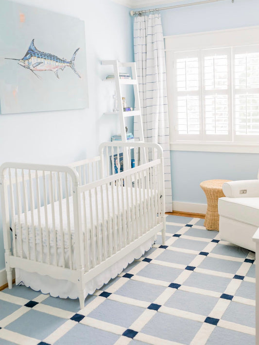 Blue Marlin canvas print featuring original coastal fishing artwork by Chelsea McShane in a nursery above a crib.